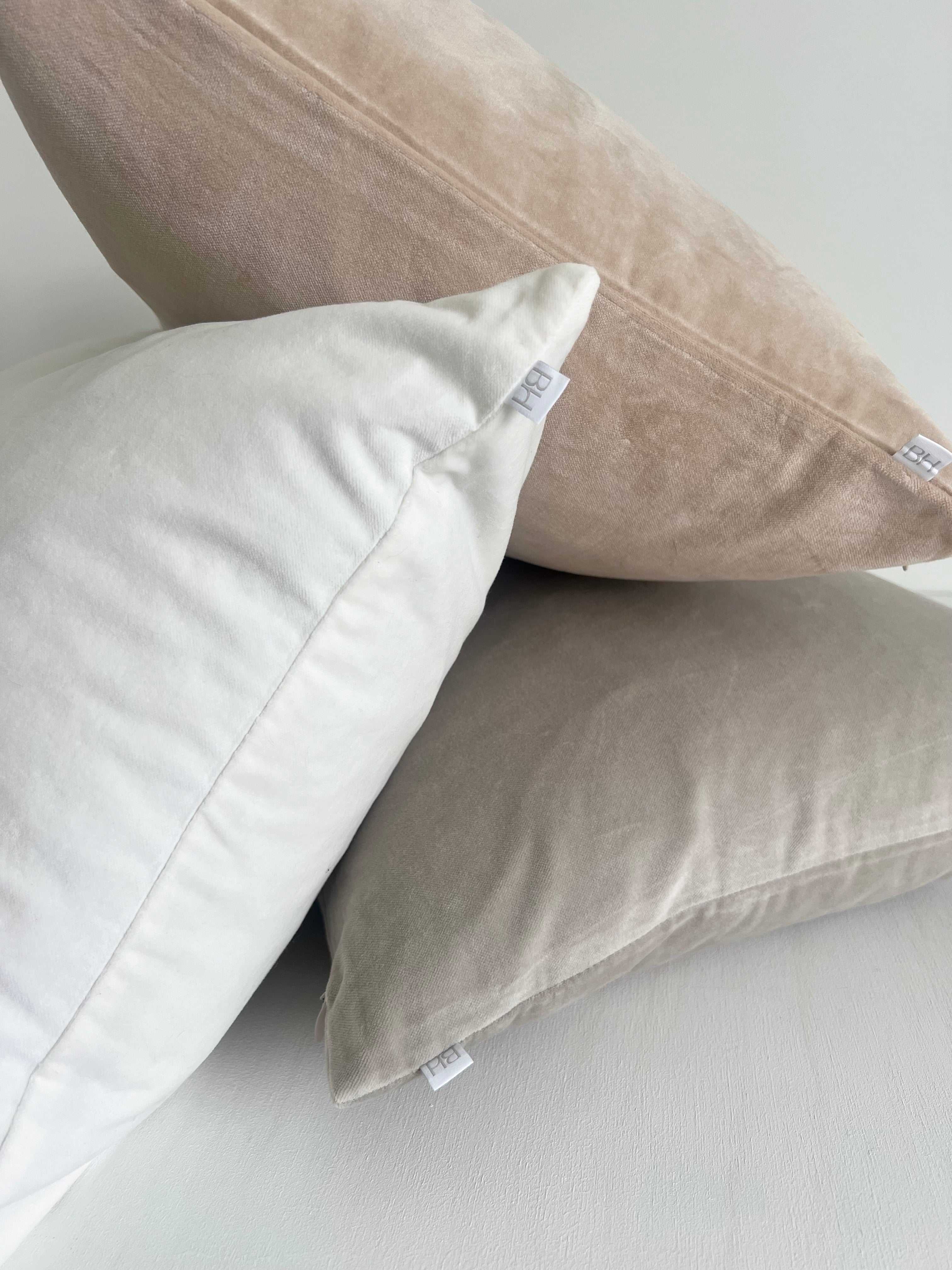 elke velvet cushion trio. sand, dove grey and white velvet with duck feather insert