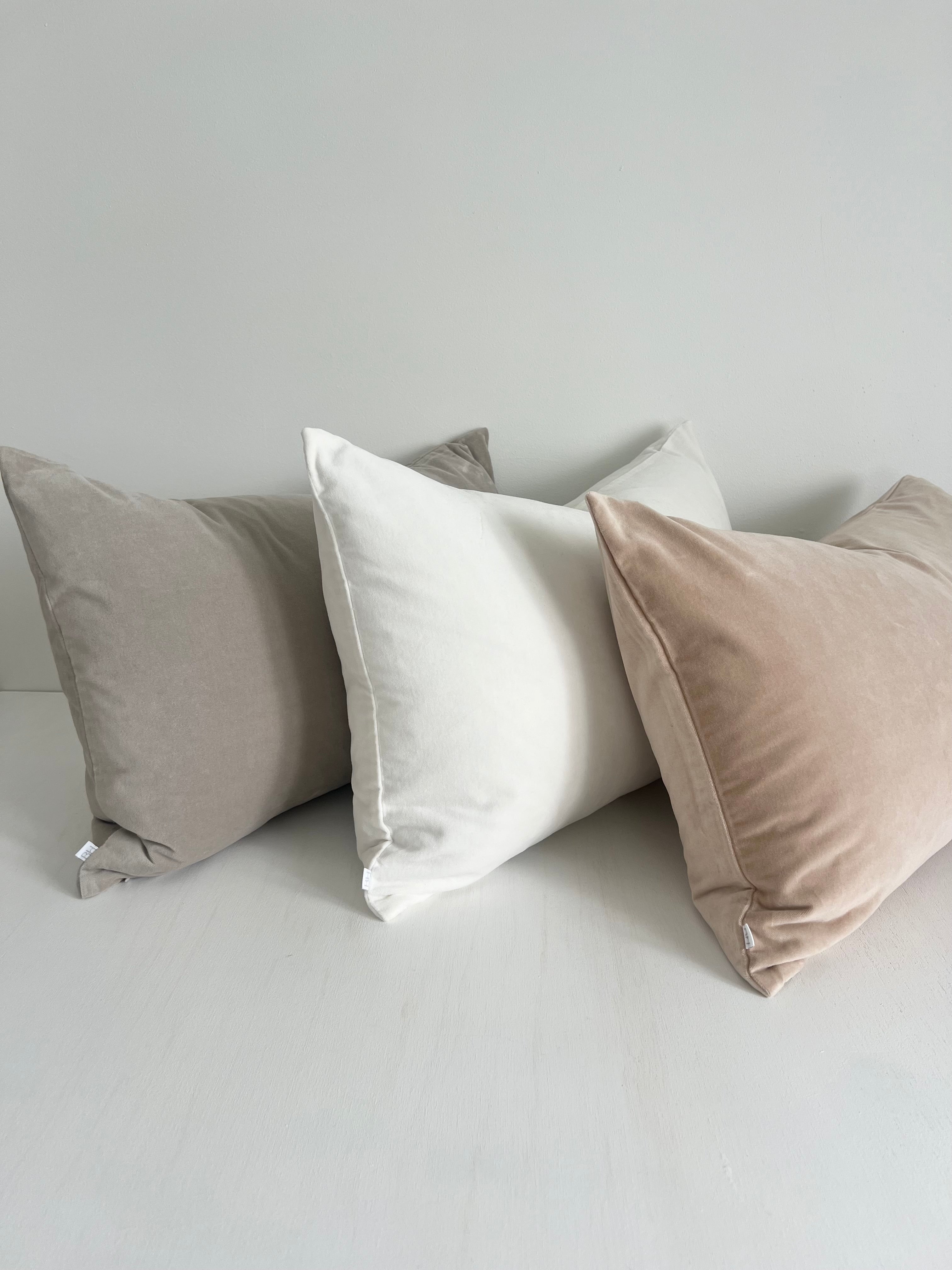Trio of bulimba home pillows in rectangle. Velvet covers in dove grey, sand and white. Duck feather pillow cushion inserts